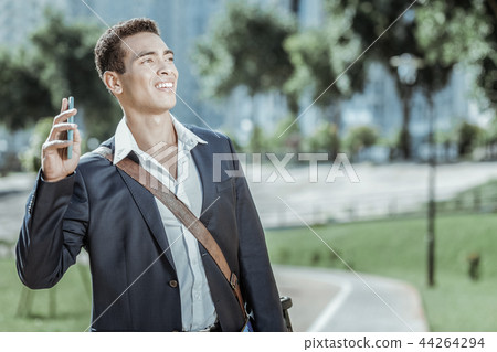 Appealing male student waving friends with hand 44264294