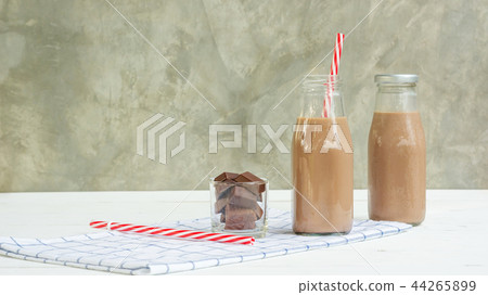 Chocolate milk on a white wooden table. 44265899