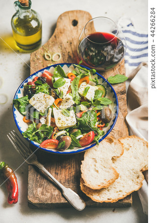 Traditional homemade Greek salad with feta cheese and olives Traditional homemade Greek salad with feta cheese and olives 44266284