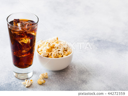 Glass of cola soda drink with ice cubes and white Glass of cola soda drink with ice cubes and white 44272359