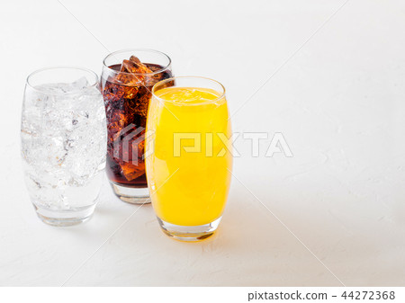 Glasses of soda drink with ice cubes and bubbles 44272368