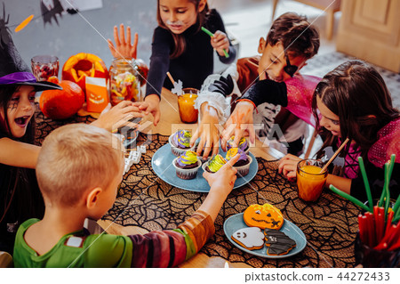 Children wearing costumes feeling nice celebrating Halloween in kindergarten 44272433