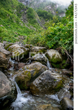 Stones and waterfall 44272843