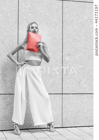 Fashion woman white outfit with red handbag Fashion woman white outfit with red handbag 44273197