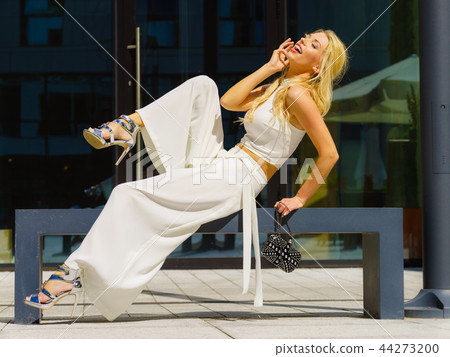 Woman wearing crop top and culottes Woman wearing crop top and culottes 44273200