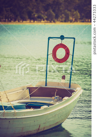 Small boat on sea water 44273333