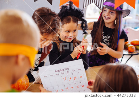 Children with painted faces cannot wait till the beginning of Halloween party Children with painted faces cannot wait till the beginning of Halloween party 44273338