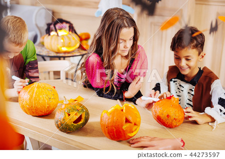 Beautiful boys and girls wearing Halloween costumes feeling amazing 44273597