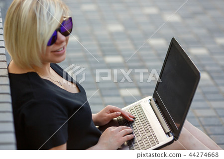 young woman freelancing with laptop young woman freelancing with laptop 44274668