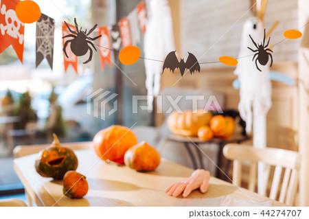 Amazing decorations as painted pumpkins and sweets in the form of scary fingers 44274707