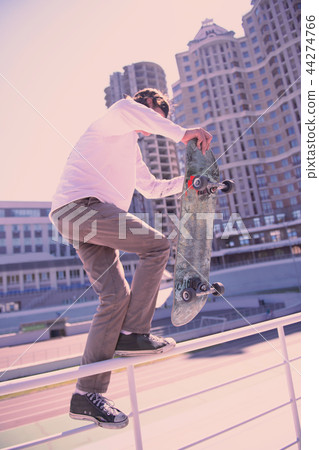 Active young man standing in semi position Active young man standing in semi position 44274766
