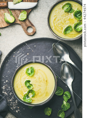 Brussels sprouts vegetable cream soup in black bowl, top view Brussels sprouts vegetable cream soup in black bowl, top view 44274974