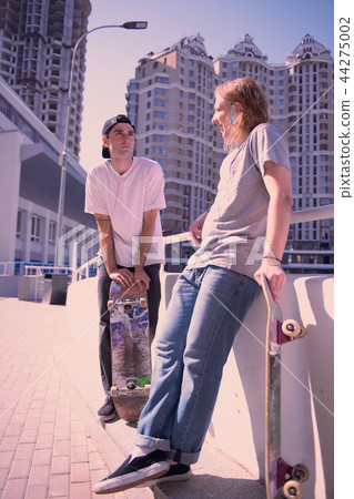 Cheerful male person standing opposite his partner Cheerful male person standing opposite his partner 44275002