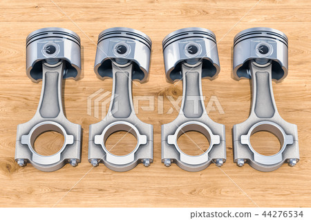 Set of engine pistons on the wooden table 44276534