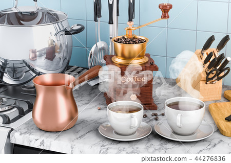 Manual coffee grinder with cups of coffee 44276836