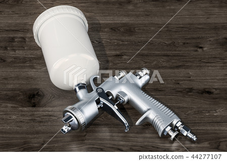 Painting spray gun on the wooden background Painting spray gun on the wooden background 44277107