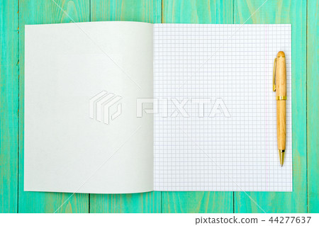 Opened squared school notebook with a pen 44277637