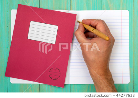 Hand writing in open school notebook Hand writing in open school notebook 44277638