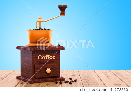 Retro manual coffee grinder on the wooden table 44278280