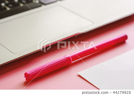Computer laptop with a pen and white paper Computer laptop with a pen and white paper 44279928