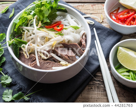 Traditional Vietnamese soup- pho in a white bowl Traditional Vietnamese soup- pho in a white bowl 44281763
