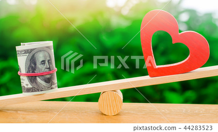 Money versus love concept. Passion versus profit 44283523