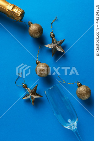 New Year - Champagne, glass and decoration toys 44284219