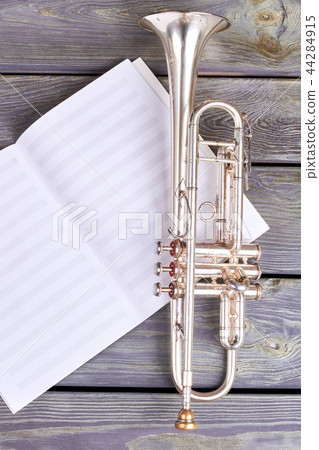Trumpet on musical notes. Trumpet on musical notes. 44284915