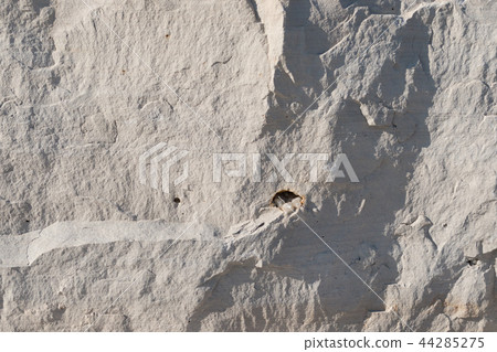 Natural limestone background textured rock face wallpaper Natural limestone background textured rock face wallpaper 44285275