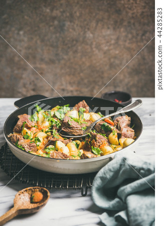 Braised beef meat with potato and carrot, copy space 44285283