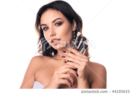 Beauty Girl with Makeup Brushes.  44285633