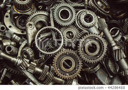 A lot of broken gears and shafts in the garbage A lot of broken gears and shafts in the garbage 44286488