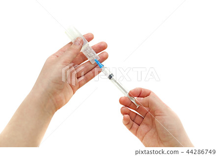 Syringe with ampoule in his hand girl 44286749