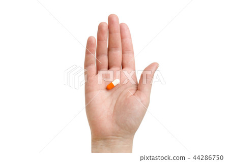 girl holding an orange capsule. Isolated on white background 44286750