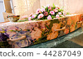 funeral casket in a hearse or chapel  44287049