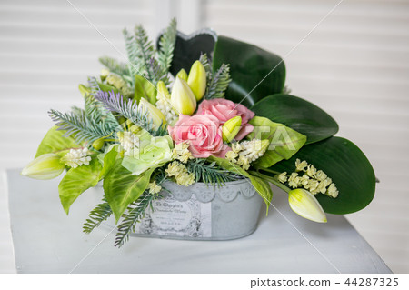 Still life with Bouquet of summer flowers in basket 44287325