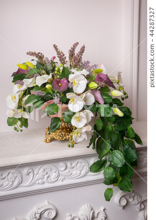 Still life with Bouquet of summer flowers in basket 44287327