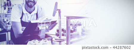 Smiling worker posing behind the counter 44287602