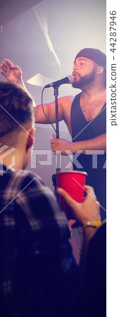 Fans cheering for singer at nightclub 44287946