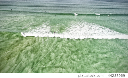 Blue ocean, Surfers on the wave, Areal view Blue ocean, Surfers on the wave, Areal view 44287969
