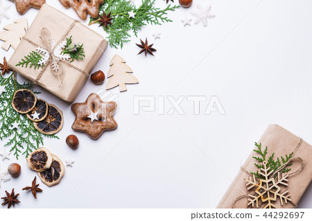 gingerbread cookies and gift box on white table gingerbread cookies and gift box on white table 44292697