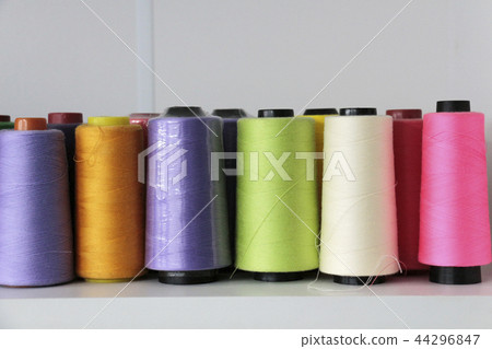 in a front row of thread in spool 44296847