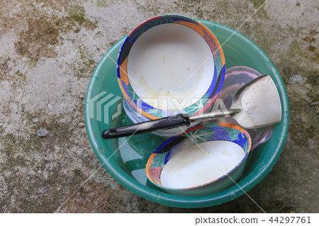 washing dishes in sink plastic green washing dishes in sink plastic green 44297761