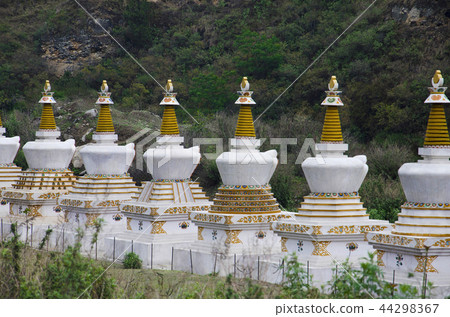 Small chortens or memorials. Lobesa Punakha Bhutan 44298367