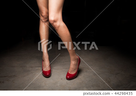 Woman wearing red high heel shoes Woman wearing red high heel shoes 44298435