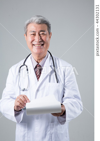 Male doctor portrait, hospital consultation Male doctor portrait, hospital consultation 44302131