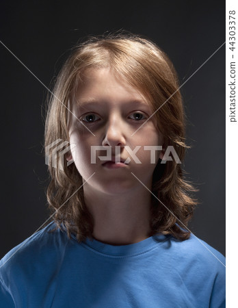 Boy with Blond Hair in Blue Top Boy with Blond Hair in Blue Top 44303378