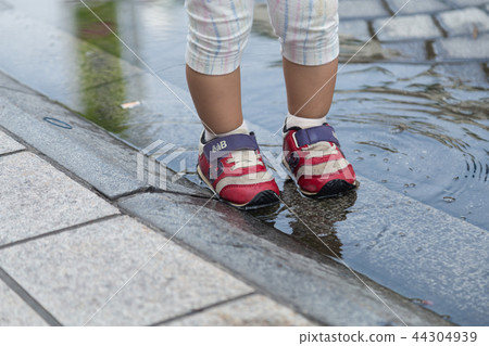 Infant playing water Infant playing water 44304939
