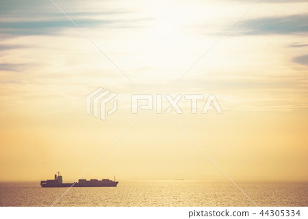 Cargo ship in the sunset Cargo ship in the sunset 44305334