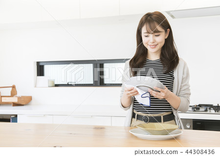 Young woman doing housework 44308436